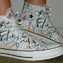 Rock and Roll High Top Chucks  Wearing white punk print high tops, right side view 1.