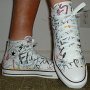 Rock and Roll High Top Chucks  Wearing white punk print high tops, right side view 2.