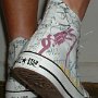 Rock and Roll High Top Chucks  Wearing white punk print high tops, rear view 2.