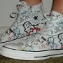 Rock and Roll High Top Chucks  Wearing white punk print high tops, left side view 1.