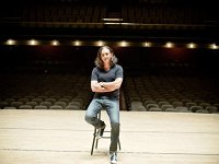 Rush  Rush lead singer/bassist Geddy Lee poses before an empty theatre.