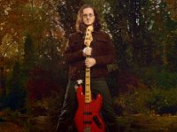 Rush  Geddy Lee poses with his signature four-string bass.