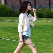 Selena Gomez  Selena playing golf.