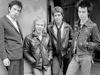 The Sex Pistols  Posed shot of the band. John Lydon is wearing high top chucks.