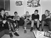 The Sex Pistols  Seated pose of the Sex Pistols. Steve Jones is wearing black high top chucks.