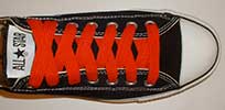 Red retro shoelaces on black low top
