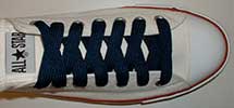 Navy blue retro shoelaces on optical white low top