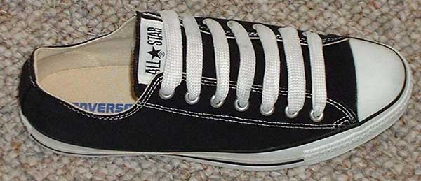 black low cut with white fat shoelaces