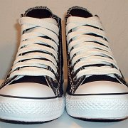 Simple Details High Top Chucks  Front view of black simple details high tops with wide white laces.