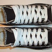 Simple Details High Top Chucks  Top view of black simple details high tops with wide white laces.