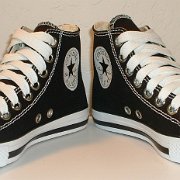 Simple Details High Top Chucks  Angled front view of black simple details high tops with wide white laces.