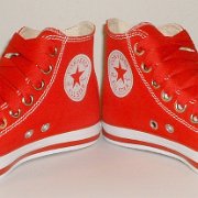 Simple Details High Top Chucks  Angled front view of red simple details high tops.