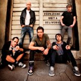 Simple Plan  Posed shot of the band. Chuck Comeau is wearing black low top chucks.