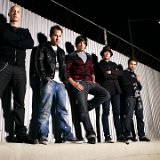 Simple Plan  Posed shot of the band. David Derosiers is wearing black chucks.