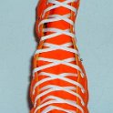 Skate Shoelaces on Knee High Chucks  White 84 inch shoelaces on a right orange knee high.