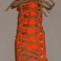 Skate Shoelaces on Knee High Chucks  Tan 96 inch shoelaces on a left orange knee high.