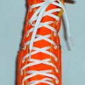 Skate Shoelaces on Knee High Chucks  White 96 inch shoelaces on a left orange knee high.
