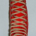 Skate Shoelaces on Knee High Chucks  Tan 84 inch shoelaces on a right red knee high.