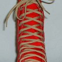 Skate Shoelaces on Knee High Chucks  Tan 96 inch shoelaces on a left red knee high.