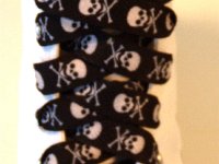 Skull Print Shoelaces On Chucks  Black and white skull print shoelace on an optical white high top.
