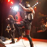 Slash  Slash performing in his red high top chucks.