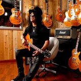 Slash  Slash with his collection of guitars.