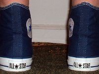 Socks for Your Chucks  No show socks worn with navy blue high tops, rear view.