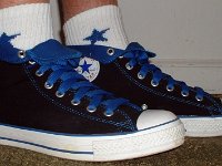 Socks for Your Chucks  Rolled down black and royal high tops with white and royal quarter high embroidered star socks.