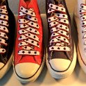 Star Print Shoelaces on Chucks  Core color high top chucks with black, white and red star print shoelaces.