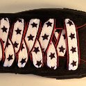 Star Print Shoelaces on Chucks  Anarchy Black high top chuck with black, white and red star print shoelaces.