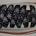Star Print Shoelaces on Chucks  Optical white low top chuck with black and silver star print shoelaces.