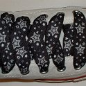 Star Print Shoelaces on Chucks  Optical white high top chuck with black and silver star print shoelaces.