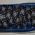 Star Print Shoelaces on Chucks  Royal blue high top chuck with black and silver star print shoelaces.