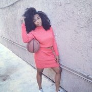 SZA  SZA poses with a basketball in a pair of white low cut chucks.