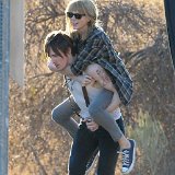 Taylor Swift  Taylor Swift wearing navy blue low cut chucks in a video, shot 1.