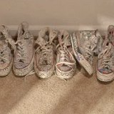 Three Months  Caleb's closet showing his pairs of illustrated optical white chucks.