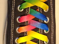 Tie Dye Shoelaces on Chucks  Black low cut chuck with rainbow tie dye shoelaces.