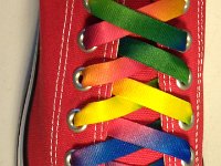 Tie Dye Shoelaces on Chucks  Red low cut chuck with rainbow tie dye shoelaces.