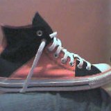 Tri-Color Chucks  Ouside view of a black and pink tri-color high top.