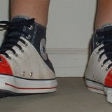 Tri-Color Chucks  Wearing red, white and blue tri-color high tops, front view.