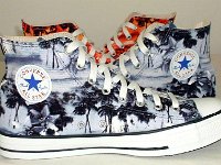 Tropical and Nautical Pattern Chucks  Blue Hawaiian high tops, side view in front of a pair of Orange Hawaiian high tops.