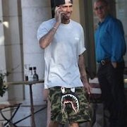 Tyga  Tyga wearing low top black chucks while on the streets of LA.