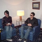 The Wallflowers  Relaxing in their chucks while talking back stage.