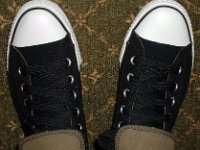 Wearing Rolled Down High Top Chucks  Top view of black and olive foldovers with fat black laces.
