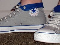 Wearing Rolled Down High Top Chucks  Left side view of gray and royal foldovers laced using the "Triangle" method with classic white shoelaces.