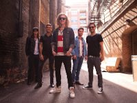 We The Kings  Posed shot of the band in an alley.