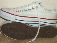 White Low Cut Chucks  Side and sole view of optical white low cut chucks.