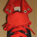 Fat (Wide) Red Shoelaces on Chucks  Black and red roll down high top with wide red laces.