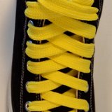 Fat (Wide) Yellow Shoelaces on Chucks  Black high top with yellow wide shoelaces.