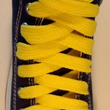 Fat (Wide) Yellow Shoelaces on Chucks  Navy blue high top with yellow wide shoelaces.